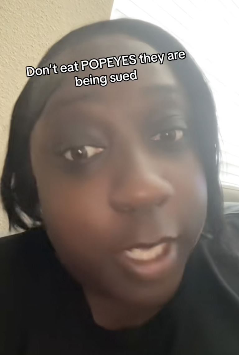 woman talking about popeyes